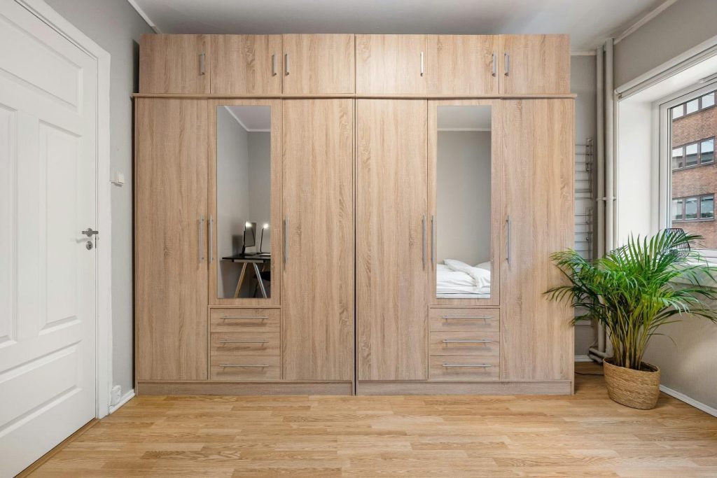 Wood swing wardrobe design with mirrored panels