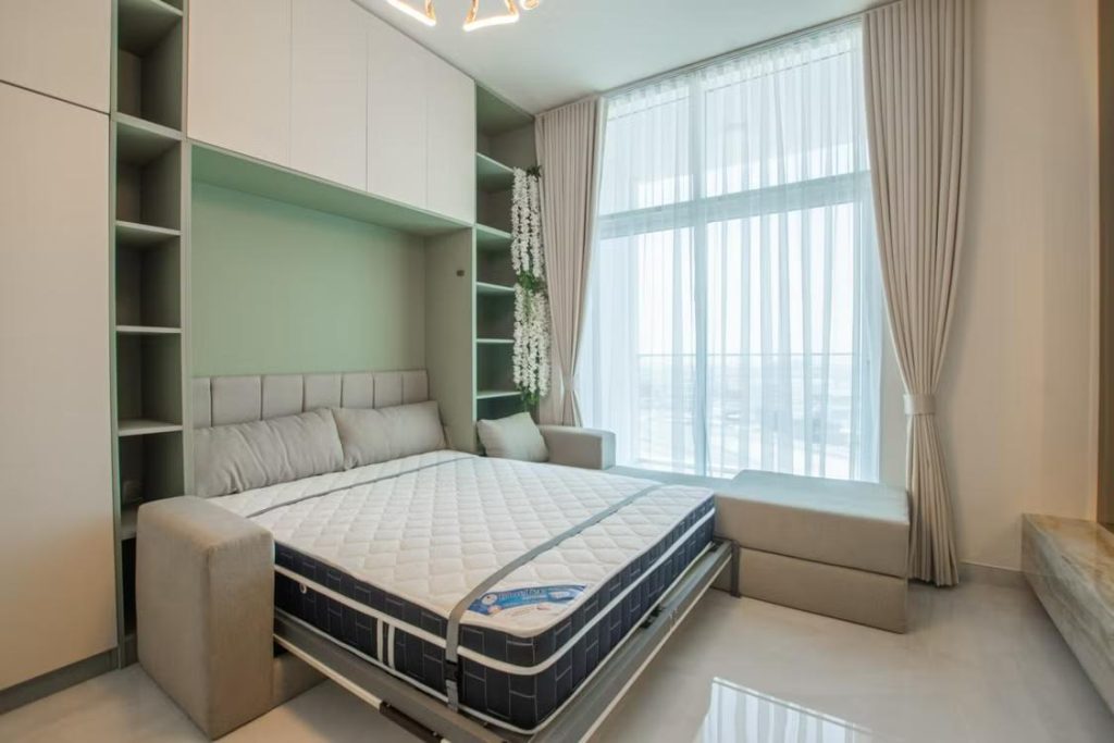 Sage green wall folding bed design, compact room