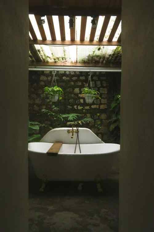  Rustic outdoor bathroom clawfoot tub brick wall