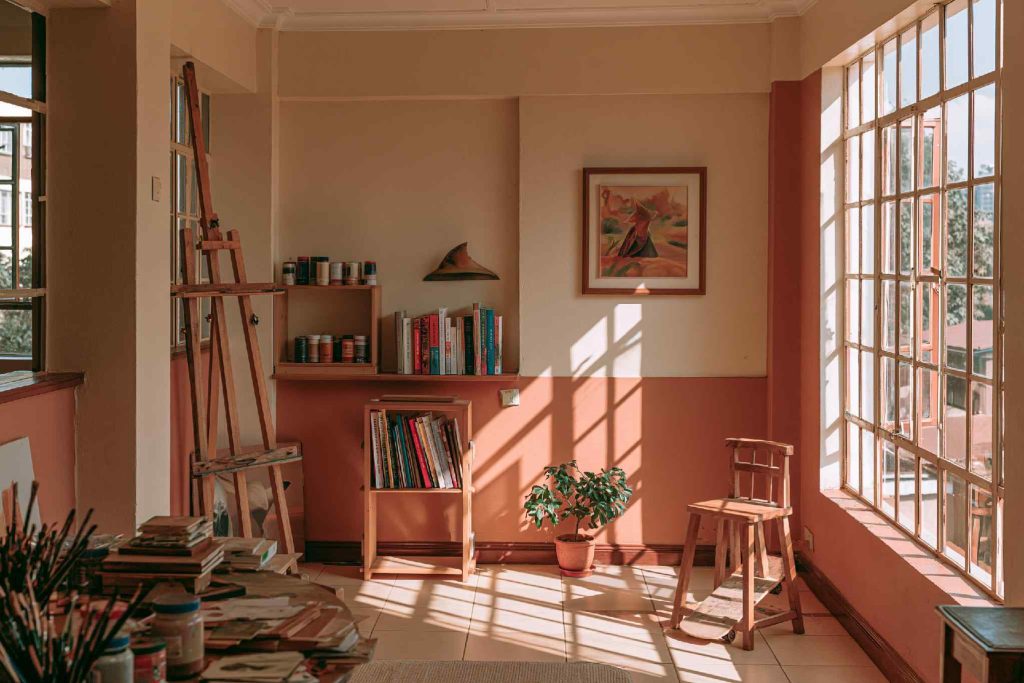 Craft room decor with easel and bookshelf