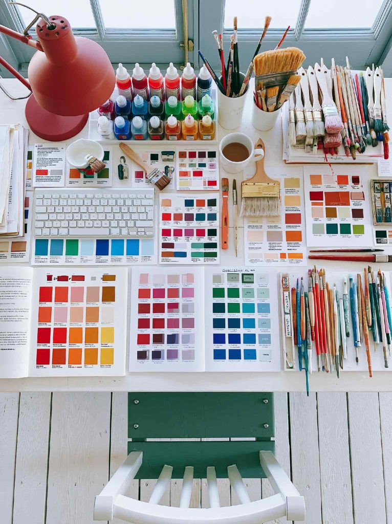 Craft room decor with paints and brushes