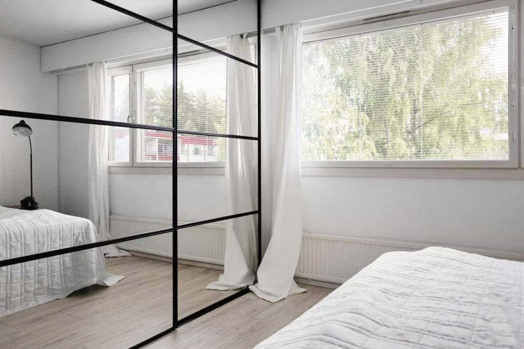 Black-framed mirrored wardrobe decoration idea
