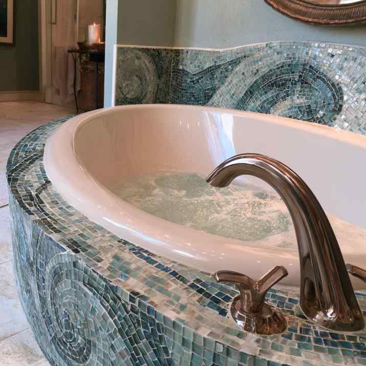 Blue mosaic bathtub tile design surround close up