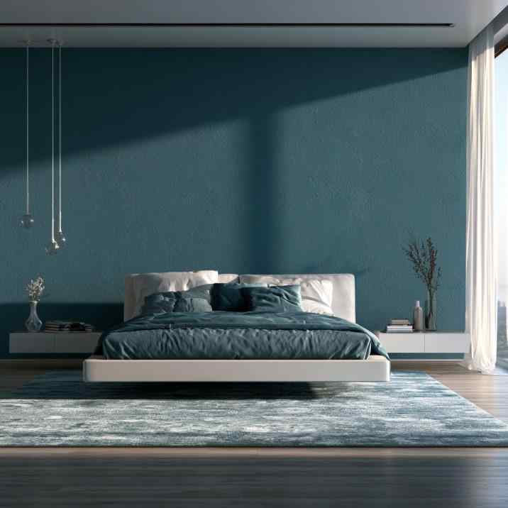 Minimalist floating bed design with teal accent wall