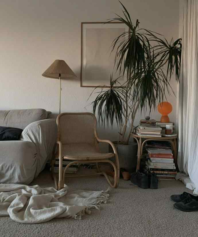 Small living room layout with rattan chair corner