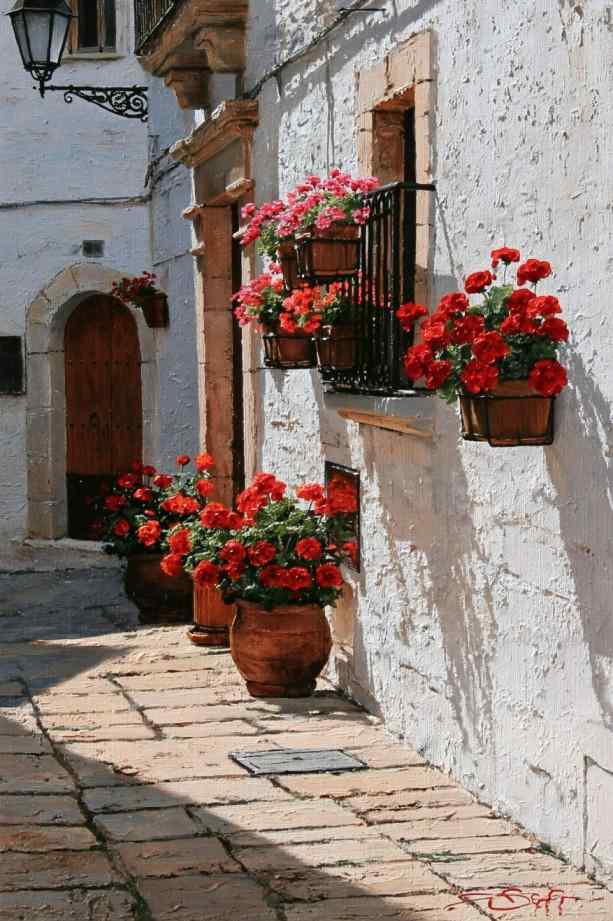 Outdoor wall design with planters and flowering vines